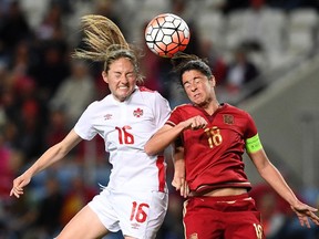 Canada forward Janine Beckie, left, vies with Spain defender Marta Torrejon during the Algarve Cup final in Faro, Portugal on Wednesday, March 8, 2017.