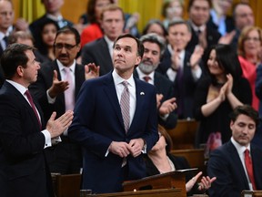 Liberal Members of Parliament give Minister of Finance Bill Morneau a standing ovation as he delivers the federal budget in the House of Commons on Parliament Hill in Ottawa, Wednesday March 22.