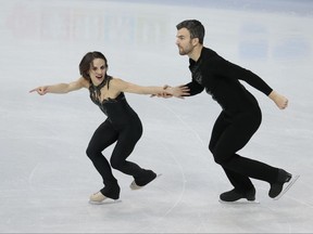 Meagan Duhamel and Eric Radford, of Canada, skate their short program at the world figure skating championships in Helsinki, Finland, on March 29.