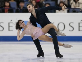 Meagan Duhamel and Eric Radford of Canada, the defending world pairs champions, skate their free program at 2017 championships in Helsinki, Finland, on Thursday, March 30, 2017.