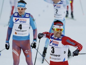 Canada's Alex Harvey (right) celebrates winning the men's 50-km race during the 2017 Nordic Skiing World Championships in Lahti, Finland on March 5.