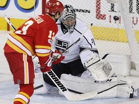 Johnny Gaudreau of the Calgary Flames flips a shot past Ben Bishop of the Los Angeles Kings during NHL action Sunday night in Calgary. Gaudreau had a goal and two assists in the Flames' 5-2 victory.