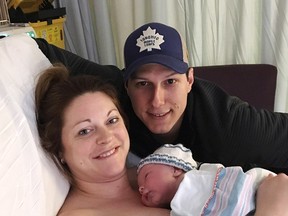 Lindsey Hubley and fiance Mike Sampson pose with their newborn baby Myles Owen Sampson at the IWK Health Centre in Halifax on March 2, 2017 in this handout photo. A Nova Scotia woman who gave birth just three weeks ago has been diagnosed with so-called flesh-eating disease and placed in an induced coma. Relatives of 33-year-old Lindsey Hubley say she delivered her son on March 2 in Halifax following a routine pregnancy, but became sick soon after returning home and was rushed to hospital by ambulance days later.