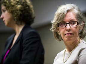 Corinne Miller, right, retired director of the state Department of Health and Human Services' Bureau of Epidemiology, at Genesee District Court in Flint, Mich.