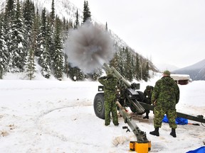 A 2011 image of a 105 mm howitzer hurling a shell at snow built up along Rogers Pass.