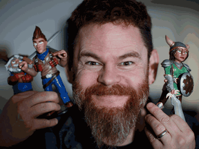 Codename Entertainment CEO Eric Jordan is photographed with characters from Crusaders of the Lost Idols and Bush Whacker 2, games created by his studio.