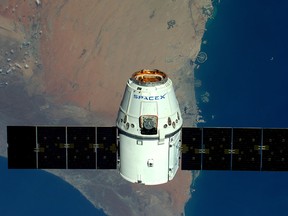 This handout image supplied by the European Space Agency (ESA), shows a view of The Palms, Dubai as the SpaceX Dragon spacecraft psses below, in an image taken by ESA astronaut Tim Peake from the International Space Station on April 10, 2016.