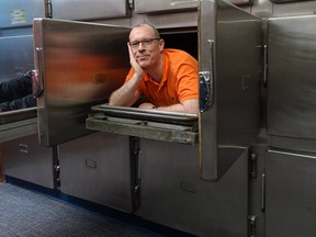 Simon Fraser University geography professor Paul Kingsbury poses at the Vancouver Police Museum's morgue.