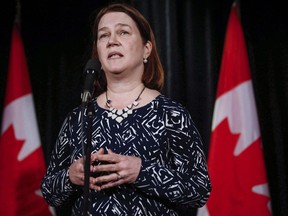 Health Minister Jane Philpott, speaks to reporters at a Liberal cabinet retreat in Calgary in a Jan. 23, 2017 file photo.