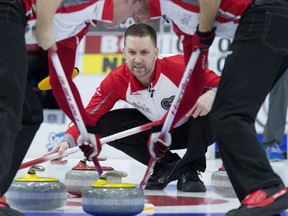 Skip Brad Gushue of St. John's, N.L. tracks an incoming shot during Thursday action at the Tim Hortons Brier in St. John's, N.L. Gushie won a pair of games to improve his record to 8-2 with one draw remaining in the round-robin. Gushue is guaranteed a spot in Friday night's 1-2 Page Playoff Game.