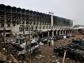 Recovery efforts after a suicide truck bombing caused damage outside the Marriott Hotel September 21, 2008 in Islamabad, Pakistan