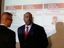 FBI agents speak before the start of a news conference about a Yahoo security breach Wednesday, March 15, 2017, in San Francisco.