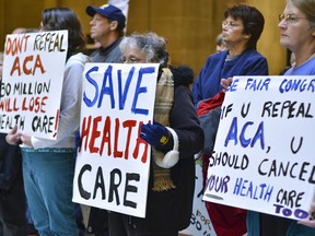 People attend a health care rally at the Indiana Statehouse in support of the Affordable Care Act, Sunday, Jan. 15, 2017, in Indianapolis.