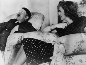 Adolf Hitler and his mistress Eva Braun rest. An album found in her dresser sold at auction in Britain on Wednesday.