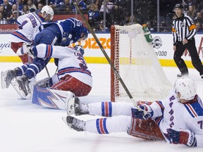 Toronto Maple Leafs forward Frederik Gaulthier crashes into New York Rangers goalie Henrik Lundqvist to earn a penalty for interference on Feb. 23.
