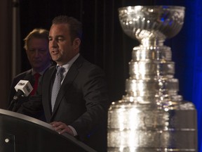 Ottawa Senators owner Eugene Melnyk looks on as Montreal Canadiens owner and President Geoff Molson speaks during an event announcing a Heritage Classic hockey game between the two teams Friday March 17, 2017 in Ottawa.