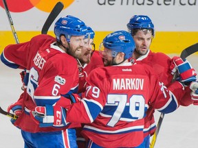Defenceman Andrei Markov (79) celebrates a goal against the Ottawa Senators with Montreal Canadiens teammates on March 25.