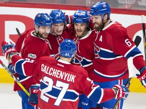 Artturi Lehkonen, second from left, celebrates with teammates Alex Galchenyuk, Andrei Markov, Andrew Shaw and Shea Weber after scoring their third goal against the Dallas Stars in Montreal on Tuesday night.