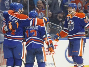 Zack Kassian (44), David Desharnais (13) and Benoit Pouliot (67) of the Oilers celebrate a goal against the Dallas Stars during second period action in Edmonto, on Tuesday.