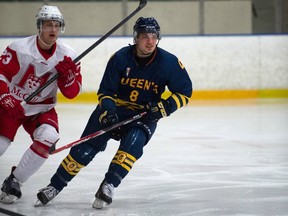 Queen's Gaels forward Alex Stothart (right) skates against the McGill Redmen in Ontario university hockey action earlier this season.