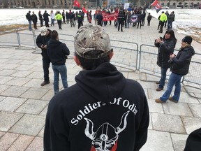 A Soldiers of Odin member eyes a counter-protest on Parliament Hill on Tuesday, March 21, 2017