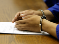 A detainee at an Immigration and Refugee Board hearing.