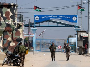 Hamas security forces stand guard at Erez border crossing into Israel, in Beit Hanun, in the northern Gaza Strip on March 26, 2017, after it was shut by the Islamist movement after blaming the Jewish state for the assassination of one of its officials in the Palestinian enclave.