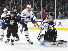 Los Angeles Kings' goaltender Jonathan Quick knocks down a shot with Auston Matthews of the Toronto Maple Leafs looking for the rebound during NHL action Thursday night in Los Angeles. Kings' defenceman Alec Martinez comes to Quick's aid. The Kings spotted the Leafs a 2-0 lead before roaring back with a pair of goals in the final period en route to a 3-2 win in the shootout.