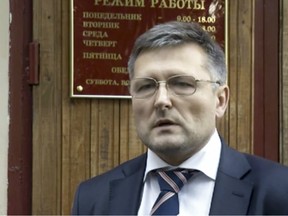 Lawyer Nikolai Govorkov leaves a court in Moscow, Russia, Sept. 13, 2012.