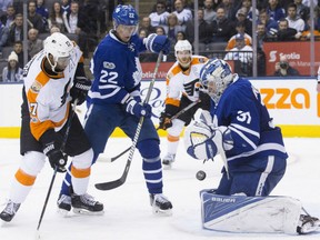 Toronto Maple Leafs' goaltender Frederik Andersen stops Philadelphia Flyers' Wayne Simmonds from close in during NHL action Thursday night at the ACC. Lending defensive assistance is Leafs' Nikita Zaitsev.  Andersen made 36 saves as the Leafs posted a 4-2 victory.