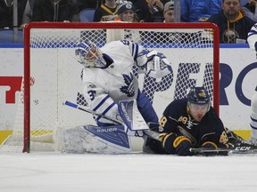 Sabres forward William Carrier collides with Toronto Maple Leafs goalie Frederik Andersen during the first period of their game, Saturday night, in Buffalo.