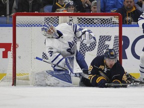 Buffalo Sabres forward William Carrier (right) collides with Toronto Maple Leafs goalie Frederik Andersen on March 25.