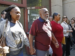 Andrew Wilson, second from left, is accompanied by his daughters, Catrina Burks, far left, and Gwen Wilson, third from left, as he leaves the Men's Central Jail in Los Angeles, Thursday, March 16, 2017