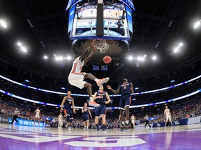 Gorjok Gak of the Florida Gators dunks against the Virginia Cavaliers during the second round of the 2017 NCAA Men's Basketball Tournament in Orlando on March 18.