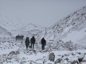 Trekkers hike towards Everest Base camp near Lobuche, Nepal, March 11, 2017.