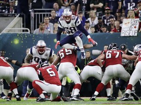 In this Feb. 5, 2017, file photo, New England Patriots defender Shea McClellin (58) leaps over the line of scrimmage in an attempt to block a kick during the Super Bowl.