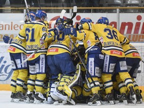Storhamar players celebrate after Joakim Jensen scored the 2-1 goal during an ice hockey match between Storhamar and Sparta Sarpsborg that lasted more than 8 and a half hours in CC Amfi, Hamar, Norway, Monday March 13, 2017.
