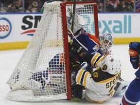Ryan Spooner of the Boston Bruins literally crashes the net, taking down Edmonton Oilers' goaltender Cam Talbot in the process during NHL action Thursday in Edmonton. The Oilers made it back-to-back victories with a 7-4 decision over the Bruins.