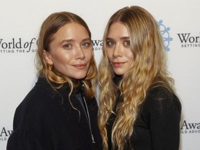FILE - In this Thursday, Nov. 6, 2014, file photo, Mary-Kate Olsen, left, and Ashley Olsen attend the 2014 World of Children Awards at 583 Park Avenue, in New York.
