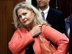 Sandra Merritt, one of the  two anti-abortion activists who made undercover videos of themselves trying to buy fetal tissue from Planned Parenthood, leaves the courtroom after turning herself in to authorities, Feb. 3, 2016.