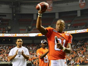 The Lions' Geroy Simon is shown celebrating after breaking the CFL all-time receiving yards record against the Winnipeg Blue Bombers at BC Place in Vancouver on June, 29 2012. Simon was named to the Canadian Football Hall of Fame on Wednesday.
