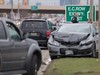 A car with serious front-end damage rests on the northbound shoulder of Howard Avenue after a serious two-car accident