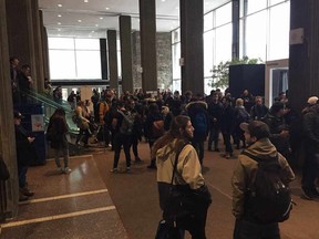 Students evacuate one of Concordia University's buildings on Wednesday after media outlets received messages alleging to bomb threats on March 1, 2017