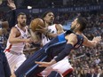 DeMar DeRozan of the Toronto Raptors comes down with the ball and is fouled by Dallas Mavericks' Salah Mejri, right, during NBA action Monday night at the ACC. DeRozan had 25 points as the Raptors posted a much-needed 100-78 victory.