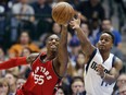 Toronto Raptors guard Delon Wright and the Mavericks' Yogi Ferrell reach for the ball during the second half of their game Saturday night in Dallas.
