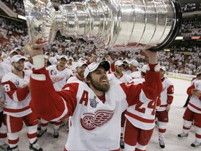 In this June 4, 2008, file photo, Detroit Red Wings forward Henrik Zetterberg hoists the Stanley Cup after the Red Wings defeated the Pittsburgh Penguins.