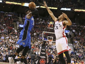 Terrence Ross, left, of the Orlando Magic, goes up for a shot against defender Norman Powell of the Toronto Raptors during NBA action Monday night at the ACC. Ross was making his return to Toronto after being traded to the Magic on Feb. 14. He had 17 points, however, the Raptors were 131-112 winners.