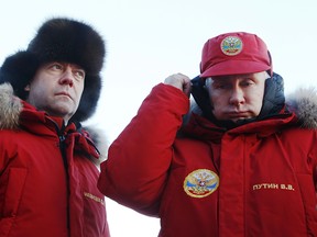 Russian President Vladimir Putin, right, and Prime Minister Dmitry Medvedev, visit Franz Josef Land archipelago in the Arctic, Russia, Wednesday, March 29, 2017. Russia has sought to strengthen its foothold in the Arctic amid intensifying rivalry for the region's rich natural resources between polar countries.