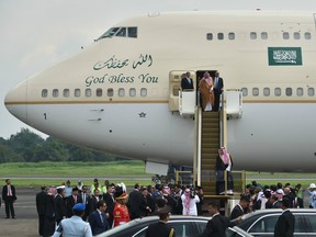 Saudi Arabia's King Salman bin Abdul Aziz (front) arrives at Halim airport in Jakarta on March 1, 2017