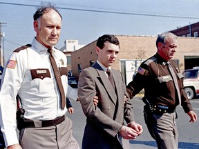 Convicted killer Donald Harvey is led back to jail on Nov. 2, 1987, by Laurel County, Ky., Sheriff Floyd Brummett, left, and an unidentified deputy after pleading guilty to eight murder charges and one voluntary manslaughter charge in London, Ky.